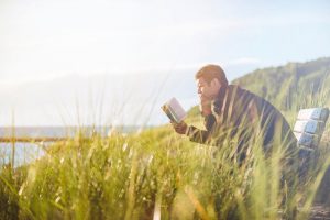man-reading-in-nature